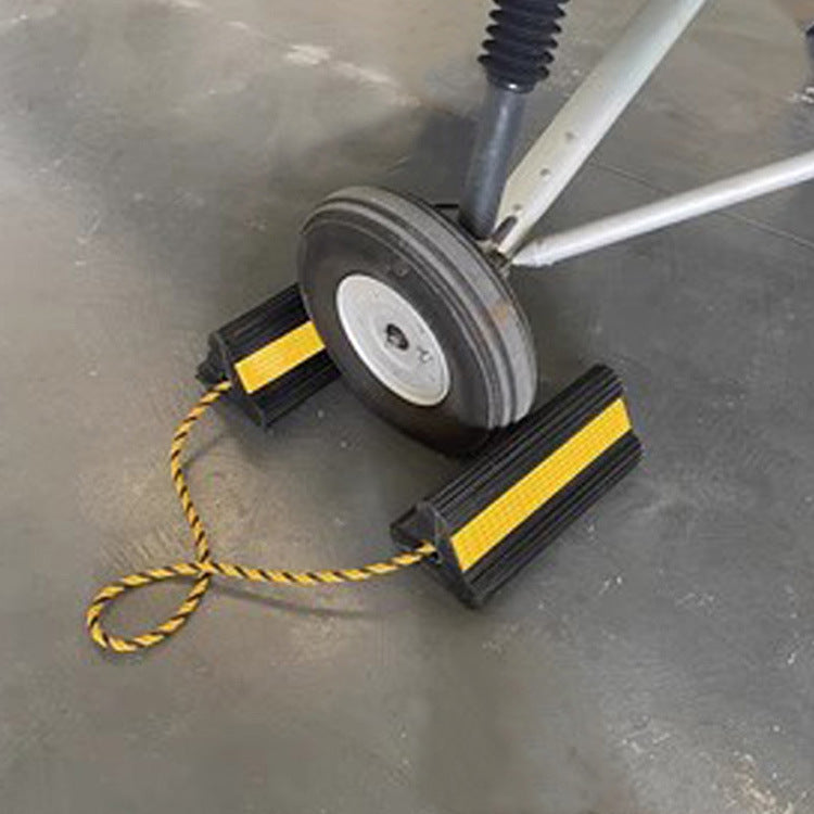 Rubber wheel stoppers for cars, trucks, airplanes, and aircraft; anti-slip triangular wooden wheel stops; ramp wheel stops.
